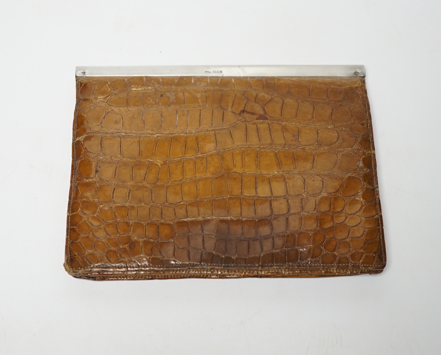 An Edwardian lady’s silver mounted crocodile clutch bag